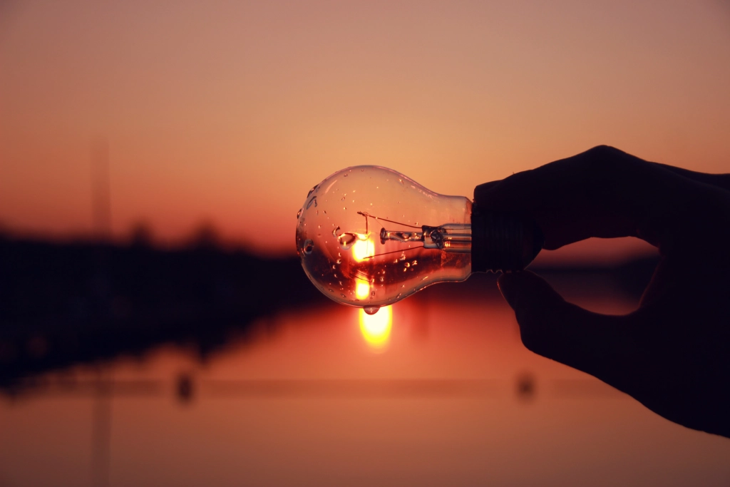 Sunset reflecting in a light bulb